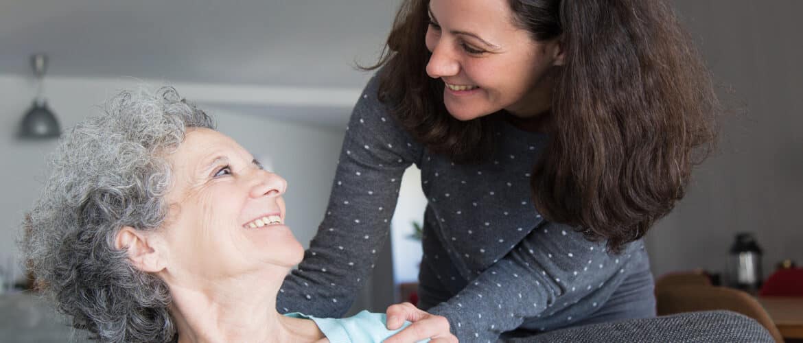 Female family caregiver reaching to embrace senior love done.